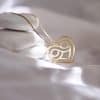 Close-up goldfilled infinity heart pendant necklace