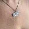 Limited Edition necklace laser cut pendant worn by woman