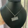Limited Edition pendant necklace with laser cut lettering
